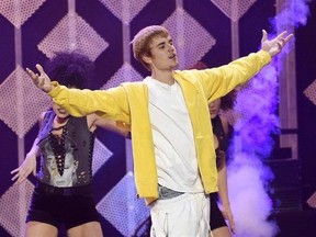 Justin Bieber performs at the 2016 Jingle Ball at Staples Center on Friday, Dec. 2, 2016, in Los Angeles. Even though Drake and Justin Bieber are vying for major Grammy awards neither is expected to show up. Drake is nominated in eight categories, but his tour schedule has him in the United Kingdom this weekend. Bieber (who has four nominations) doesn&#039;t have as solid an excuse. The international leg of his &ampquot;Purpose&ampquot; tour doesn&#039;t start until next week. THE CANADIAN PRESS/AP, Chris Pizzello, Invis