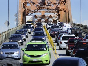 Heavy traffic streams across the old Pattullo Bridge during rush hour at New Westminster in June 2013.