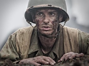 FILE - This image released by Summit shows Andrew Garfield in a scene from &ampquot;Hacksaw Ridge.&ampquot; The film has been nominated for an Oscar in the best picture and best directing categories. Movie fans can watch a variety of Oscar-nominated flicks online from their couches for a fee. The films ‚ÄúArrival‚Äù and ‚ÄúHell or High Water‚Äù can be rented through Amazon, Google Play or Apple‚Äôs iTunes, but viewers will have to buy downloads of ‚ÄúHacksaw Ridge,‚Äù ‚ÄúManchester by the Sea‚Äù and ‚ÄúMoonligh