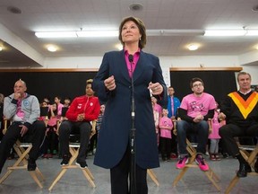 B.C Premier Christy Clark speaks to a crowd while attending an Erase Bullying in Sport event in collaboration with Pink Shirt Anti-Bullying Day in Burnaby, B.C., on Wednesday, February 22, 2017. THE CANADIAN PRESS/Ben Nelms