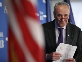 Senate Minority Leader Chuck Schumer of N.Y. walks back to his seat after giving opening remarks during a news conference at the National Press Club in Washington, Monday, Feb. 27, 2017. (AP Photo/Alex Brandon)