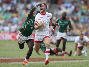 SYDNEY, AUSTRALIA - FEBRUARY 05:  Luke McCloskey of Canada is tackled during the 13th place play-off match between Canada and Kenya in the 2017 HSBC Sydney Sevens at Allianz Stadium on February 5, 2017 in Sydney, Australia.