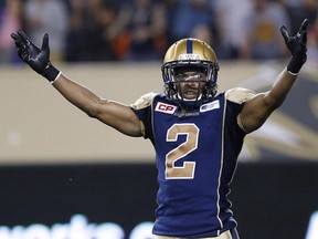 Matt Bucknor celebrates a Blue Bombers win over the B.C. Lions in CFL action in Winnipeg Thursday, July 30, 2015. The Lions signed Canadian defensive back Bucknor on Thursday.