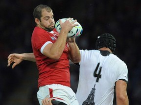 Canada's Brett Beukeboom wins the ball against Romania's Valentin Poparlan in a line out during the Rugby World Cup Pool D match between Canada and Romania at the Leicester City Stadium, Leicester, England, Tuesday, Oct. 6, 2015. Brett Beukeboom didn't think twice about swapping English rain for Uruguay's sun and humidity.After helping his rugby club to a league victory last weekend, the Canadian took an eight-hour bus ride home from Leeds to the town of Penzance in southwest England.
