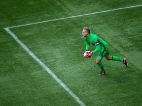 Vancouver Whitecaps' goalkeeper David Ousted grabs the ball out of the air during second half MLS soccer action against the New York Red Bulls, in Vancouver, Saturday, September 3, 2016.