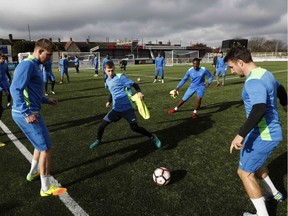 Sutton United players train on Thursday ahead of their FA Cup fifth-round game against Premier League giant Arsenal. The teams meet Feb. 20.