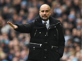Manchester City manager Pep Guardiola gestures on the touchline during the English Premier League match between Manchester City and Swansea City at the Etihad Stadium in Manchester, on Feb. 5, 2017.