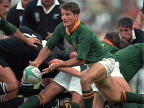 FILE - In this Saturday, June 24, 1995 file photo, South Africa's scrumhalf Joost van der Westhuizen lets fly a pass during the World Cup final against New Zealand at Ellis Park in Johannesburg. Joost van der Westhuizen, who won the 1995 World Cup with South Africa as Nelson Mandela looked on, has died after a six-year-battle with motor neuron disease. He was 45. South Africa Rugby announced the death Monday, Feb. 6, 2017.