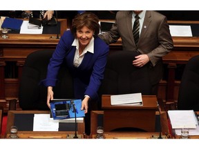 Premier Christy Clark arrives Tuesday in the legislature in Victoria, where her government introduced its pre-election budget.