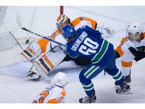 Markus Granlund shoots on Michal Neuvirth.