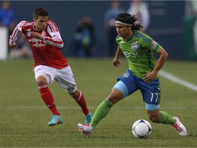 Fredy Montero, right, scored goals in China, Portugal and Seattle. The Vancouver Whitecaps are hoping he does that for them this season, too.