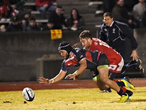 USA fullback Mike Te'o drives for the loose ball in the Canadian end zone. It was his third try of the game.