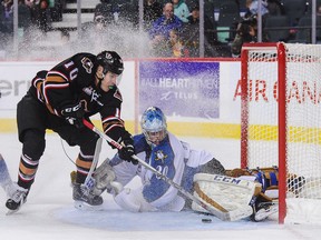 One former Vancouver Giant, Jakob Stukel, tries to score on another, Payton Lee, in his Dec. 18 WHL games. Stukel's Calgary Hitmen beat Lee's Kootenay Ice 3-2 that night.