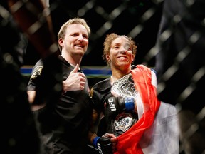 Germaine de Randamie of The Netherlands celebrates with the belt after defeating Holly Holm.