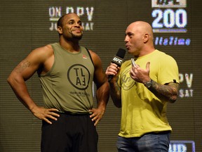 LAS VEGAS, NV - JULY 08:  Mixed martial artist Daniel Cormier (L) is interviewed by commentator Joe Rogan after Cormier's weigh-in for UFC 200 at T-Mobile Arena on July 8, 2016 in Las Vegas, Nevada. Cormier will meet Anderson Silva in a non-title light heavyweight bout on July 9 at T-Mobile Arena. Silva replaces Jon Jones who was pulled from a light heavyweight title fight against Cormier due to a potential violation of the UFC's anti-doping policy.  (Photo by Ethan Miller/Getty Images)