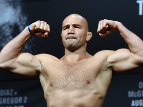LAS VEGAS, NV - AUGUST 19:  Mixed martial artist Glover Teixeira poses on the scale during his weigh-in for UFC 202 at MGM Grand Conference Center on August 19, 2016 in Las Vegas, Nevada. Teixeira will meet Anthony Johnson in a light heavyweight bout on August 20, 2016, at T-Mobile Arena in Las Vegas.  (Photo by Ethan Miller/Getty Images)