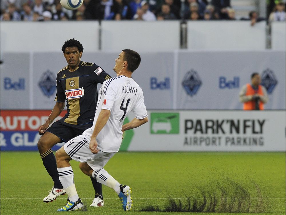 VANCOUVER, B.C.: JUNE 18, 2011 -- Alain Rochat of the Vancouver Whitecaps fights for the ball with Sheanon Williams of the Philadelphia Union at Empire Field in Vancouver on June 18, 2011 . (photo by Jenelle Schneider/PNG)(PNG story by sports)TRAX: 00053901A [PNG Merlin Archive]