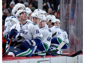 Alex Burrows and the rest of his Canucks teammates on the bench.