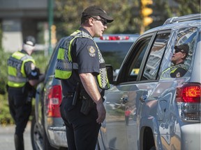 VPD officers pull over drivers during a distracted-driving awareness campaign in 2014.