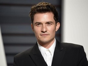 FILE - This Feb. 26, 2017 file photo shows Orlando Bloom at the Vanity Fair Oscar Party in Beverly Hills, Calif. Bloom and singer Katy Perry are breaking up after about a year together. Representatives for Perry and Bloom released a statement Wednesday saying: ‚Äú... we can confirm that Orlando and Katy are taking respectful, loving space at this time.‚Äù (Photo by Evan Agostini/Invision/AP, File)