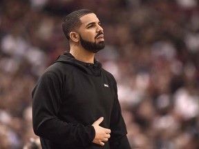 Rapper Drake watches the action between the Indiana Pacers and the Toronto Raptors during first half NBA playoff basketball action in Toronto on Tuesday, April 26, 2016. Drake has finally delivered &ampquot;More Life,&ampquot; but he hasn&#039;t necessarily handed us all the answers. THE CANADIAN PRESS/Frank Gunn