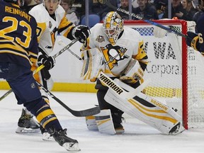 Buffalo Sabres Sam Reinhart (23) is stopped by Pittsburgh Penguins goalie Matthew Murray (30) during the first period of an NHL hockey game, Tuesday, March 21, 2017, in Buffalo, N.Y. (AP Photo/Jeffrey T. Barnes)