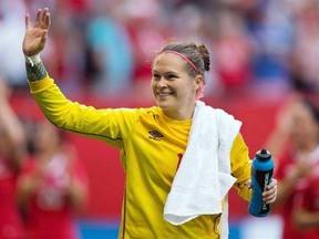 Canada goalkeeper Erin McLeod waves to fans after defeating Switzerland 1-0 in a FIFA Women&#039;s World Cup round of 16 soccer match in Vancouver on June 21, 2015. Veteran Canadian goalkeeper McLeod is back training with her Swedish club team after the latest in a line of knee surgeries. THE CANADIAN PRESS/Darryl Dyck