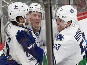 Brock Boeser celebrates his fist NHL goal on Saturday in