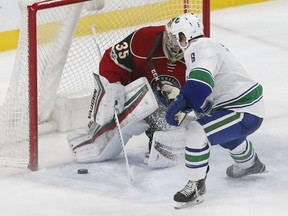 Brock Boeser gets top the net and scores in his NHL debut Saturday.