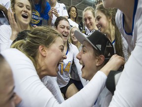 UBC Thunderbirds Juliana Kaufmanis (left) and Danielle Brisebois celebrate after defeating the University of Alberta Pandas to win the 2017 U Sports Women's National Volleyball Championships action at Ryerson University in Toronto, ON, March, 19, 2017. (Rich Lam/UBC Athletics Photo)