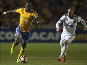 Marcel de Jong of the Vancouver Whitecaps, right, chases Luis Advincula of Mexico's Tigres during their CONCACAF Champions League match on March 14 at the Universitario stadium in Monterrey, Mexico.
