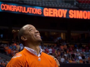 Former B.C. Lions' receiver Geroy Simon watches during a ceremony where the CFL team retired his number 81 during halftime of their game against the Winnipeg Blue Bombers on Friday July 25, 2014 at B.C. Place.
