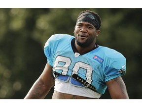 Carolina Panthers' Frank Alexander, a three-time offender of the NFL's drug policy, signed with the B.C. Lions on Tuesday.