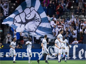 Vancouver Whitecaps' Fredy Montero, front right, celebrates his goal against the New York Red Bulls during second half CONCACAF Champions League quarter-final soccer action in Vancouver, B.C., on Thursday, March 2, 2017.