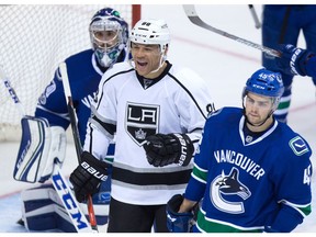 Jarome Iginla of the Los Angeles Kings celebrates his goal against Canucks goaltender Ryan Miller as Michael Chaput, right, looks on during Friday's NHL action in Vancouver.