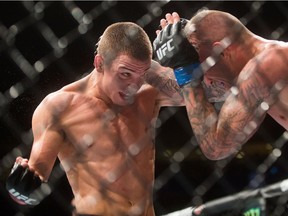 Jeremy Kennedy, left, of Surrey, fights Alessandro Ricci in a lightweight bout at UFC Fight Night in Vancouver last August.