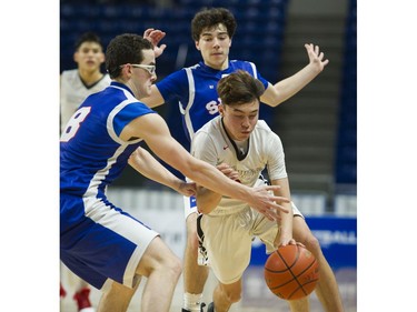 St Michaels University school Blue Jags #8 Sammy de Vries fouls Brentwood College School #3 Brendan Sullivan in the final of the 2A 2017 BC  Boys High School Basketball Championship at LEC, Langley March 11 2017.   Brentwood won 54-44.