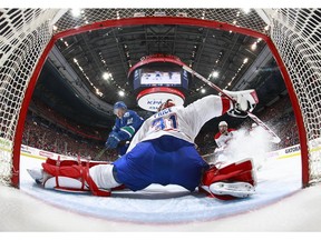 Carey Price makes a save against Nikolay Goldobin.