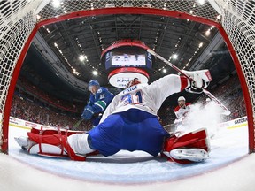Nikolay Goldobin tests Carey Price's flexbility during the Canucks-Canadiens game at Rogers Arena earlier this month.