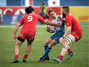 Canadians young (Luke Bradley, right) and less young (Nathan Hirayama, left) stop France's Terry Bouhraoua. Both Canadians are players who came up through elite programs.