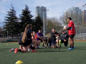 Waisale Serevi speaks with young First Nations rugby players at Livingstone Park in Vancouver on March 10.