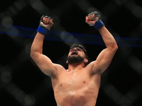 TORONTO, ON - DECEMBER 10:  Kelvin Gastelum of the United States celebrates victory over Tim Kennedy of the United States in their Middleweight bout during the UFC 206 event at Air Canada Centre on December 10, 2016 in Toronto, Canada.  (Photo by Vaughn Ridley/Getty Images)