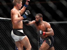 Welterweight champion Tyron Woodley (R) punches Stephen Thompson in their title fight during UFC 209 on March 4, 2017 in Las Vegas, Nevada. Woodley defended his title with a majority-decision win.