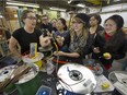 Women learn from instructor Kavan Anne Smith, front left, in an electrical program at BCIT's women-in-trades class on Feb 21. Front right, Katie Melen and, rear from left, Jen Kuta, Emily Wilson, Sophie Trinch, Chantell Woods and Eva Ho, learn the basics.