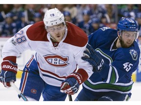 Michael Chaput of the Vancouver Canucks battles with Montreal Canadiens defenceman Nathan Beaulieu during Tuesday's NHL game at Rogers Arena. Chaput scored a goal in Vancouver's 2-1 overtime defeat.