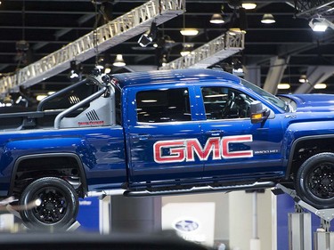 A GMC 2500 pick up sits above the rest of the vehicles on display at the Vancouver Auto Show held at Vancouver Convention Centre West, Vancouver March 28 2017.