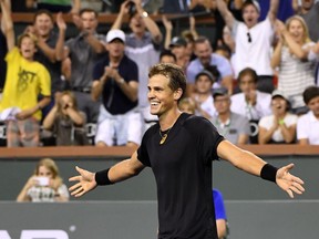 Vasek Pospisil celebrates after defeating Andy Murray, at the BNP Paribas Open tennis tournament, Saturday, March 11, 2017, in Indian Wells, Calif. Pospisil won the match 6-4, 7-6 (5).