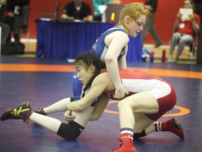 Pinetree secondary wrestler Jacqueline Lew, bottom, in action.