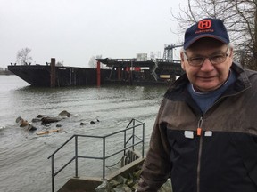 Terry Slack, a veteran gillnetter and Fraser River watchdog, next to a barge used to dump sediments at a federal marine disposal site off Point Grey near UBC.