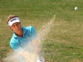 Bernhard Langer hits out of the bunker to the 18th green for a par finishing at 11-under par for second place, four strokes behind winner Stephen Ames, in the Mitsubishi Electric golf Classic at TPC Sugarloaf on Sunday, April 16, 2017, in Duluth, Ga. (Curtis ComptonAtlanta Journal-Constitution via AP)